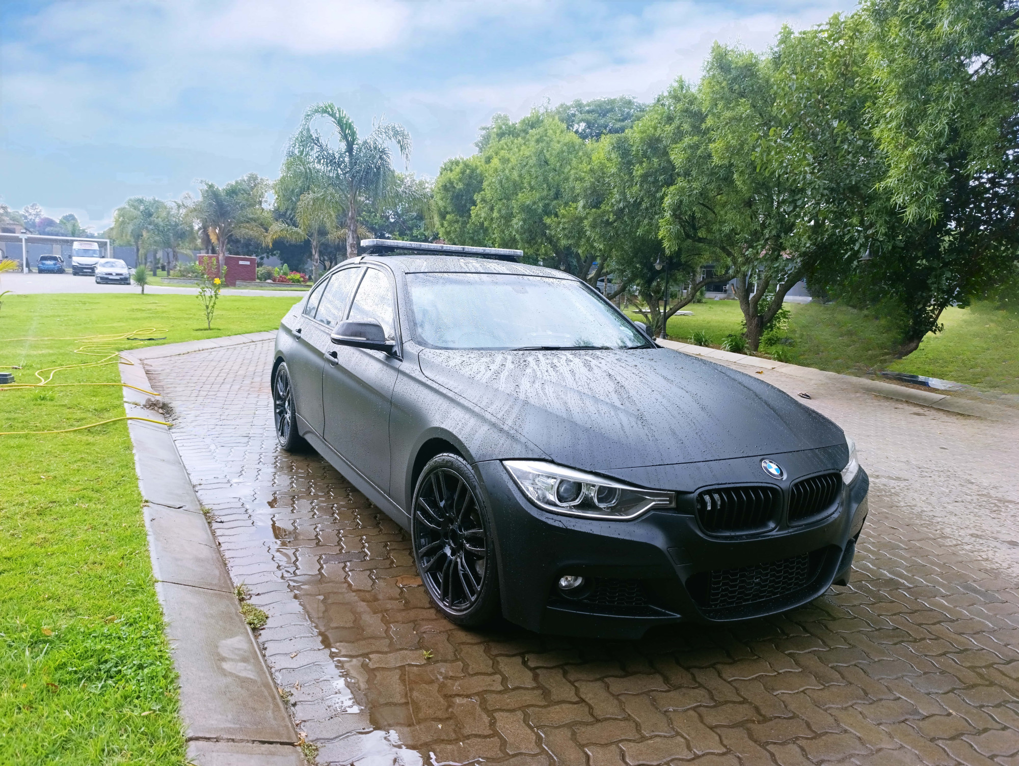 Matte satin black full vehicle wrap on BMW F30 3 Series by Remmogo Signaling and Branding, Midrand South Africa